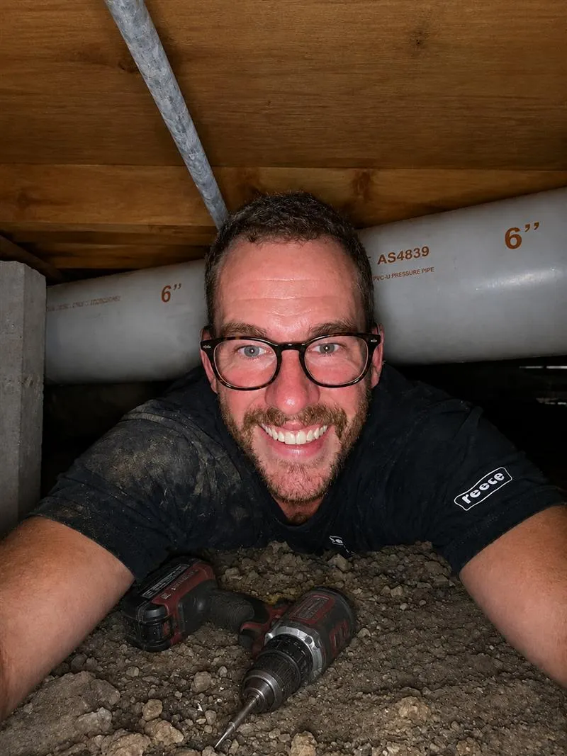 Will smiling while working on pipework in the crawl space under a home