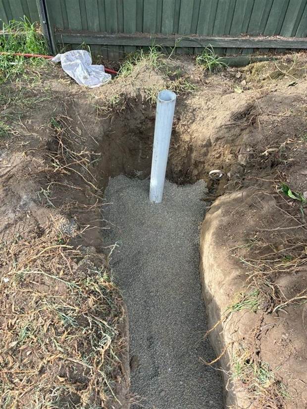 New PVC sewer pipe bedded in screenings in the open trench at the Brunswick West job