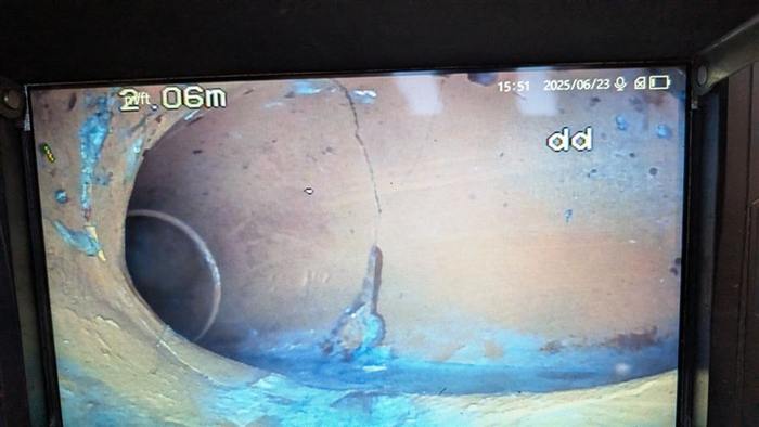 CCTV drain camera monitor showing the cracked clay sewer found under the Richmond property