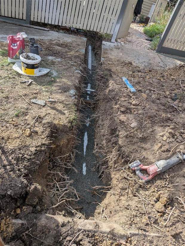 The new stormwater line bedded in screenings in the open trench at the Surrey Hills job